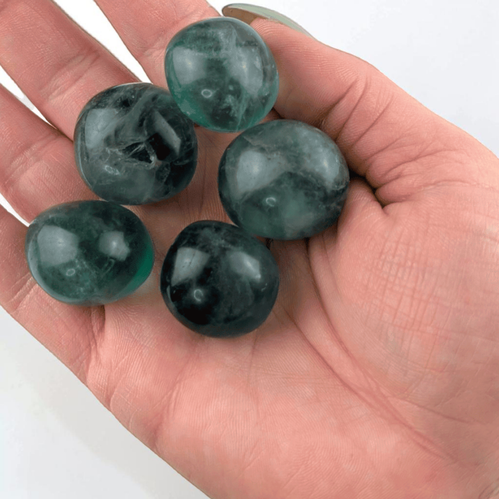 Green tumbled Fluorite on neutral background
